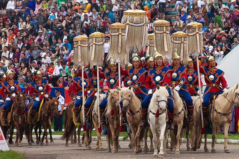 Mounted honour guard with ceremonial banners at the Naadam Festival opening ceremony, Ulaanbaatar